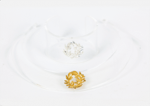 Silver or gold platted wreath on an acrylic glass neckless