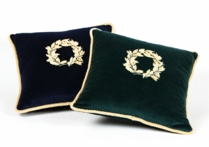 Velvet pillow with a gold embroidered wreath