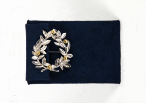Silver or gold platted medium brooch with with gold plated details