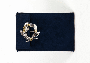 Silver or gold platted small brooch with gold plated details