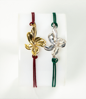 Silver or gold platted small bracelet with a colored string