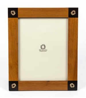 Wooden picture frame with four small gold plated wreaths